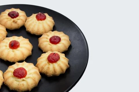Biscuits with strawberry on plate Stock Photos