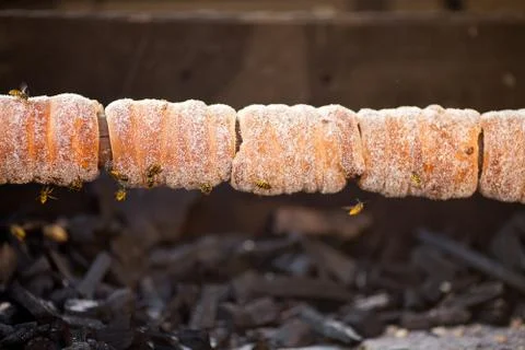 Biscuits in sugar roasting on a spit Stock Photos