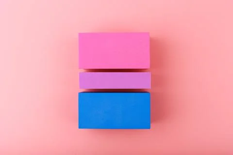 Bisexual pride flag made of blocks on bright pink background Stock Photos