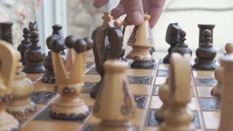 Bishop attacking King. Wooden chess. 動画素材 145437074
