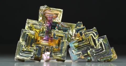 Bismuth crystals. Bismuth - chemical element with symbol Bi and atomic number 83 Stock Footage 333574835