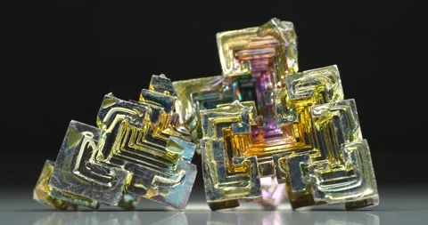 Bismuth crystals. Bismuth - chemical element with symbol Bi and atomic number 83 Stock Footage 334002413
