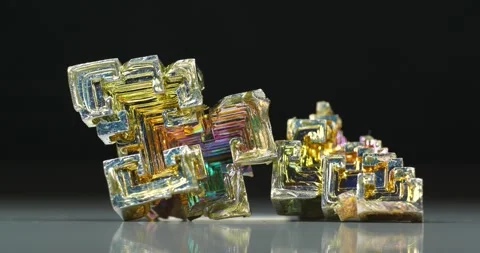 Bismuth crystals. Bismuth - chemical element with symbol Bi and atomic number 83 Stock Footage 338357659