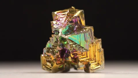 Bismuth crystals. Bismuth - chemical element with symbol Bi and atomic number 83 Stock Footage 339569894
