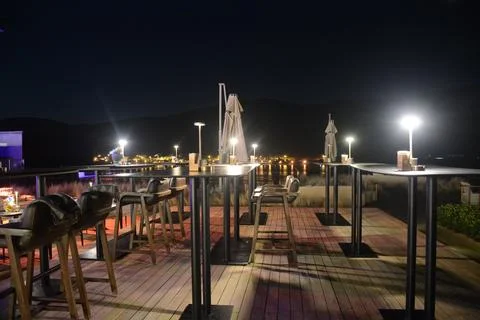 Bistro tables at night Stock Photos