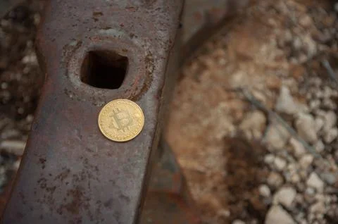 Bit coin on anvil Fotos de archivo