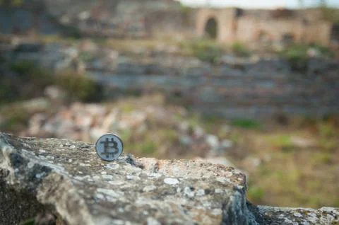 Bit Coin on old wall Fotos de archivo