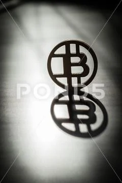 Bit coin with sunlight reflection on it Stock Photos