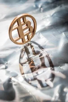 Bit coin with sunlight reflection on it Fotos de archivo