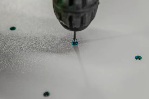 The bit is fixed in the screwdriver. Stock Photos