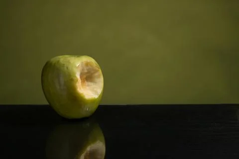 Bit green apple, green on one side and green mirror table Stock Photos