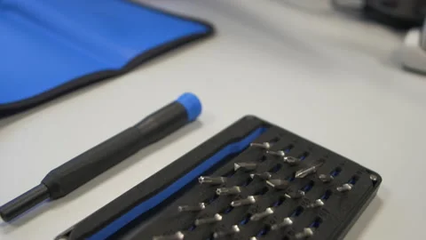 Bit screwdriver set prepared for use on a blue mat Stock Footage 170733236