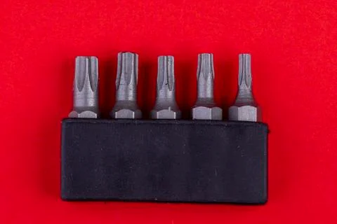 Bit set for screwdriver on red background Stock Photos