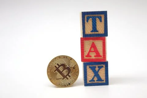 Bitcoin on 3 red blocks that say TAX on a white background. Crypto currency.. Stock Photos