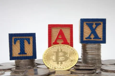 Bitcoin on 3 red blocks saying TAX on top of a pile of coins. Crypto curren.. Stock Photos