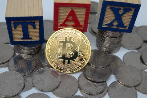 Bitcoin on 3 red blocks saying TAX on top of a pile of coins. Crypto curren.. Stock Photos