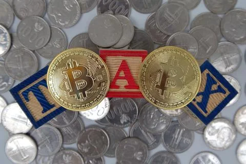 Bitcoin on 3 red blocks saying TAX on top of a pile of coins. Crypto curren.. Stock Photos