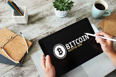 Bitcoin accepted here sign on screen. E-payment, Cryptocurrency and financial Stock Photos