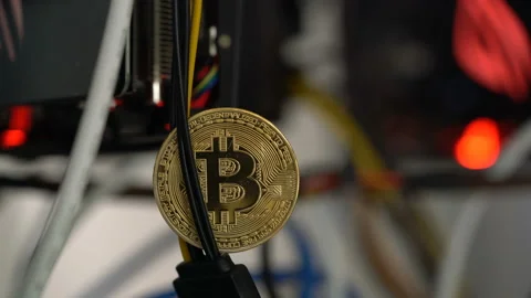 Bitcoin against the background of cables in the rack for crypto-currency mining Video stock 86772887