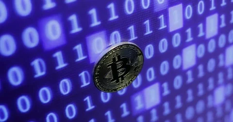 Bitcoin against monitor with binary code. Crypto currency Gold Bitcoins - BTC - Видео 82913687