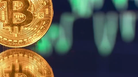Bitcoin and bitcoin chart. Cryptocurrency trading. Bitcoin graphic. Stock Footage 232054260