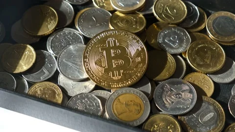 Bitcoin and coins of different countries. Stock Footage 172143828