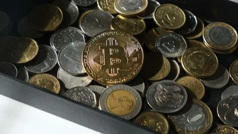 Bitcoin and coins of different countries. Stock Footage 172143865