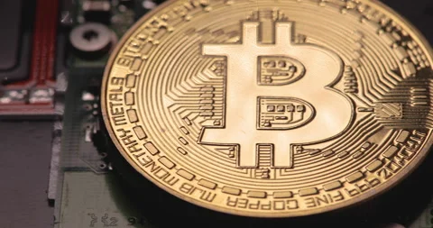 Bitcoin and computer circuit board, panning shot, 4K Stock Footage 145373373