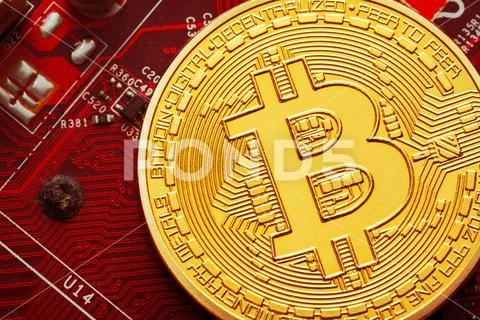 Bitcoin and a computer graphic card Stock Photos
