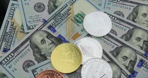 Bitcoin and cryptocurrency on banknotes of one hundred dollars. Stock Footage 100577151