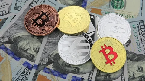 Bitcoin and cryptocurrency on banknotes of one hundred dollars. Stock-Footage 100587323