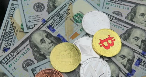 Bitcoin and cryptocurrency on banknotes of one hundred dollars. Stock Footage 100587436