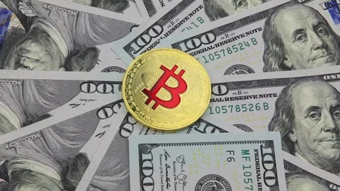 Bitcoin and cryptocurrency on banknotes of one hundred dollars. Stock Footage 100587634