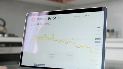 Bitcoin and cryptocurrency volatility. Part of laptop screen with bitcoin Stockbeeldmateriaal 217729221