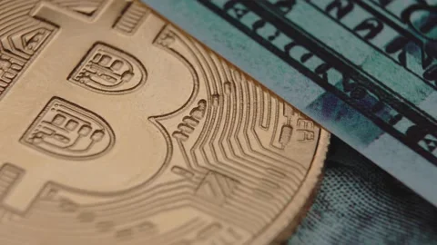 Bitcoin and dollars lie side by side. World currency. Close-up Stock Footage 151112200