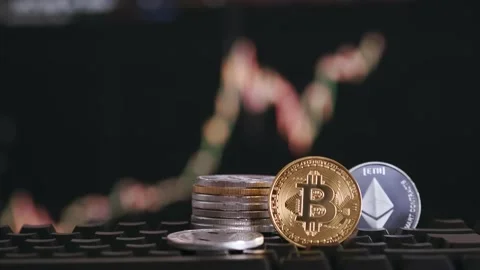 Bitcoin and ethereum on background blurry chart of growth and decline Stock Footage 162810397
