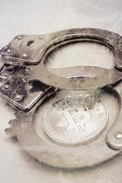 Bitcoin and handcuffs Stock Photos