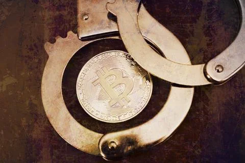 Bitcoin and handcuffs Stock Photos