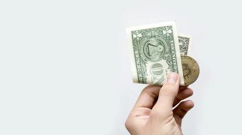 Bitcoin and one dollar currency of the world. Stock Photos