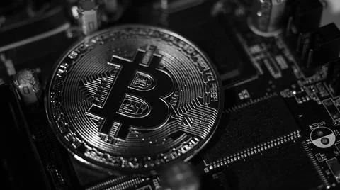 Bitcoin and semiconductor. Represent mining in Cryptocurrency cause global wa Stock Photos