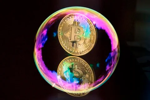 Bitcoin and a soap bubble on black background Stock-Fotos