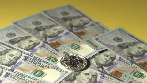 Bitcoin and USD 100 dollars cash bills Stock Footage 143374993
