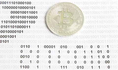 Bitcoin on the background of binary code Stock Photos