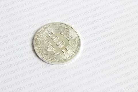 Bitcoin on the background of binary code Stock Photos