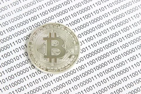 Bitcoin on the background of binary code Stock Photos
