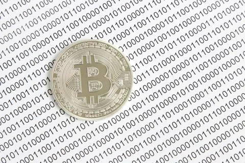 Bitcoin on the background of binary code Stock Photos