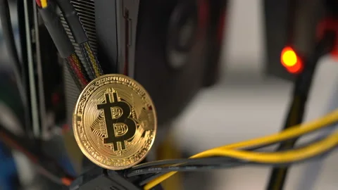 Bitcoin on the background of a graphics card in a rack for crypto-currency Stock Footage 86771475