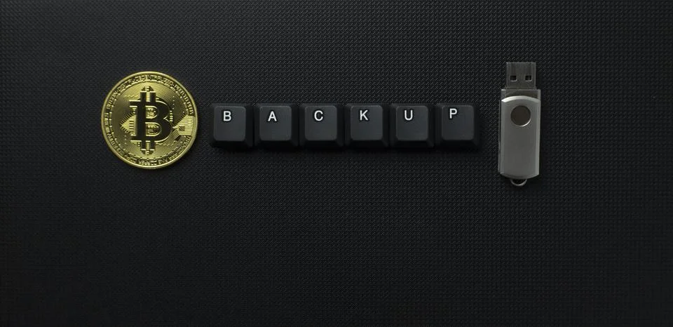 Bitcoin Backup Security Concept With USB Drive And Keyboard Keys Stock Photos