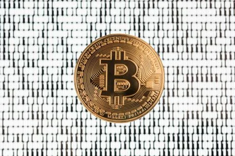 Bitcoin on binary code blurred background Stockfoto's