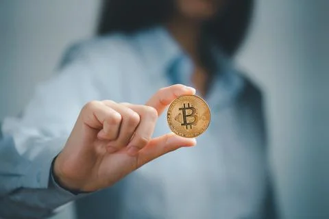 Bitcoin, Bitcoin in hand of woman, Digital cryptocurrency Online, virtual fut Stock Photos